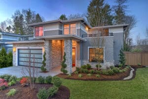 Modern contemporary house exterior with luxury details landscaping, stone, wood, glass, lots of large windows